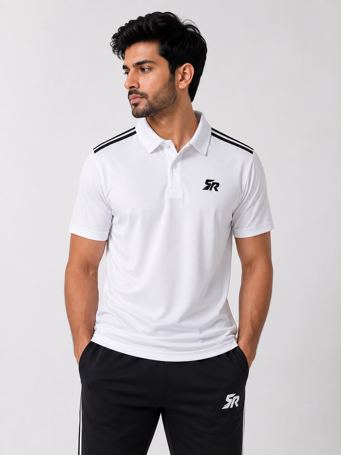 SmashNRun Shadow90 Polo in white with twin shoulder stripes worn with black Shadow90 track pants