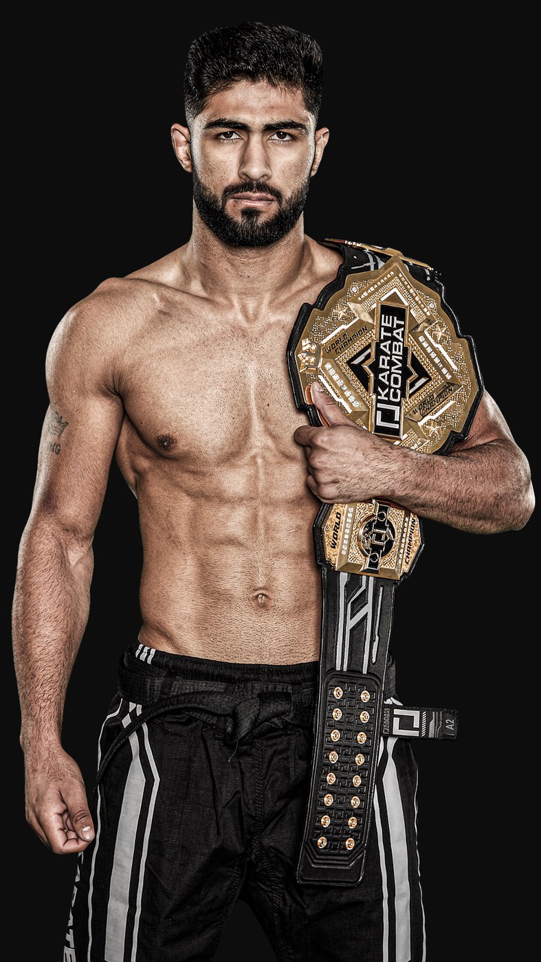 Shahzaib Rind with the Karate Combat championship belt